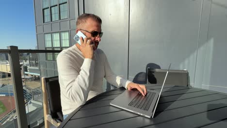 tensions rise as a business man navigates a heated conversation from his outdoor work from home office