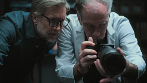 two scientists reviewing a photo