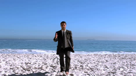 businessman walking on the beach like a robot