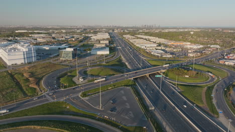 wide aerial view of a highway interchange in mississauga, ontario, with industrial buildings