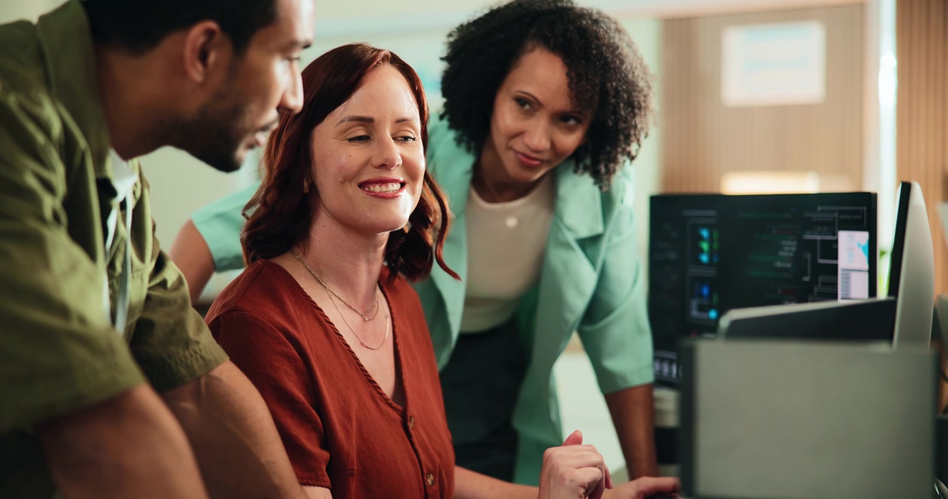 Diverse Team Collaborating on Project in Modern Office