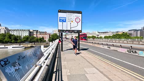 cyclists, pedestrians, and buses on waterloo bridge