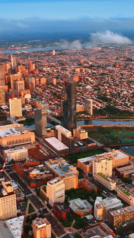 sunlit philadelphia panorama at daytime. drone footage over the vast cityscape at sunset. vertical video