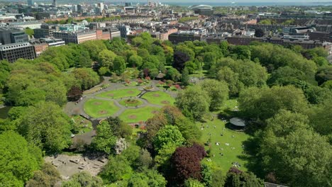 Forward travelling aerial video of St Stephen's Green in Dublin City Centre, County Leinster, Ireland, on a bright and sunny day. Produced in 4K, 60FPS and with Rec709 color.