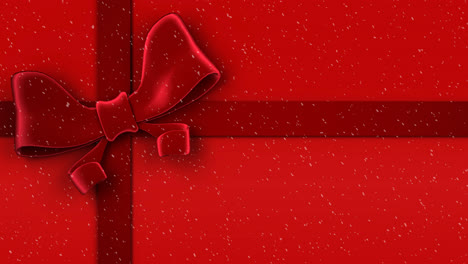 animation of snow falling against christmas present ribbon on red