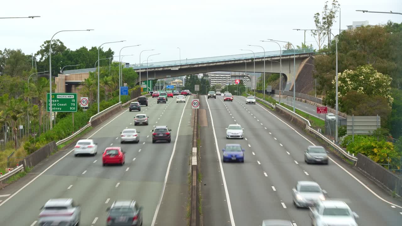 Views of traffic flow on M3 inner city bypass Pacific motorway from Vulture street captured in time-lapse shot.