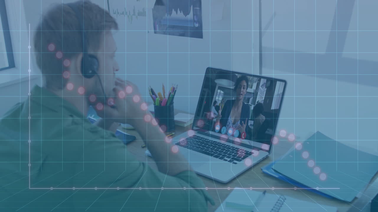 Man in headphones video conferencing over financial graph animation on laptop screen