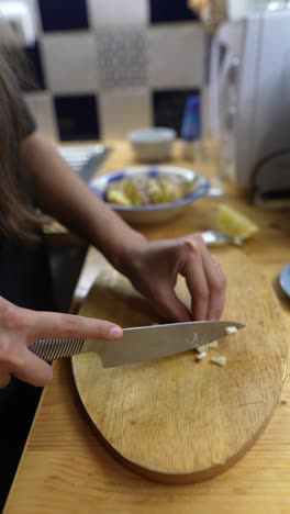 woman chopping garlic