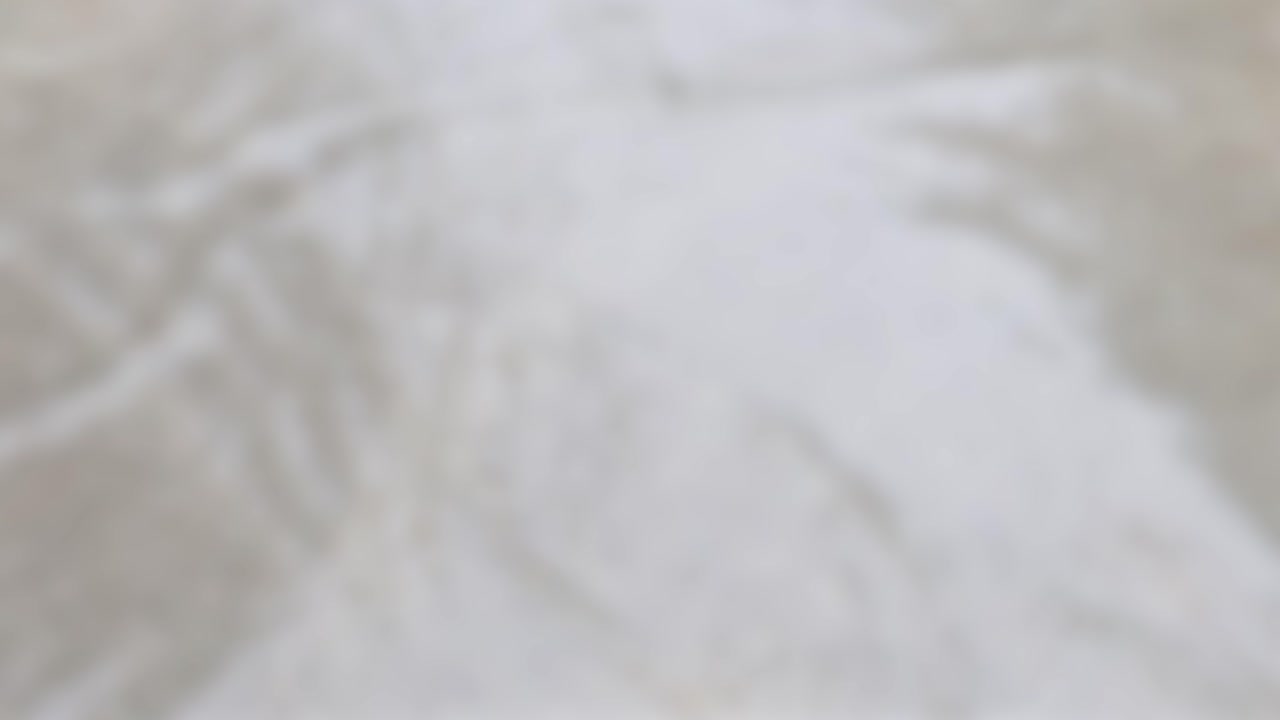 A serene river scene with soft lighting and textured water surface, creating a calming and peaceful atmosphere