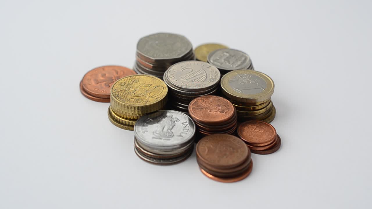 Coins of the different countries of the world. Coins on a white background
