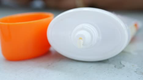 sunblock tube with orange cap