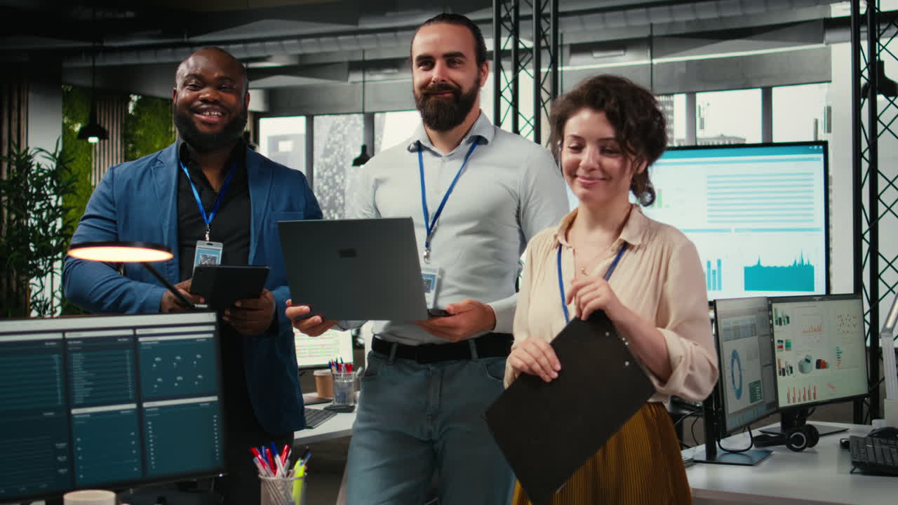 Vertical Video Portrait of multiethnic employees work with performance metrics and high tech