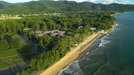 Aerial-Parallax-Over-A-Beautiful-Beachfront-Resort-Village-In-Khao-Lak,-Thailand