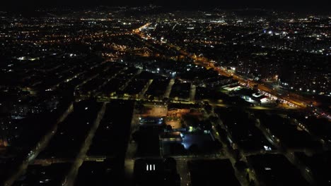 Topview-droneshot-by-night,-watching-over-the-city-Bogota,-capital-of-Colombia