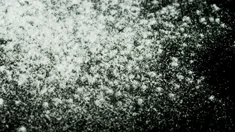 flour dust on black background