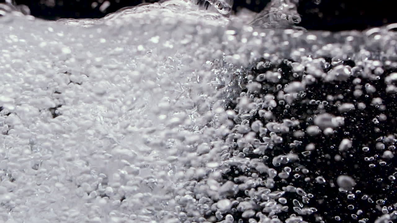 Slow Motion Water Bubbles in Relaxing Bath at Spa or Sink Washing