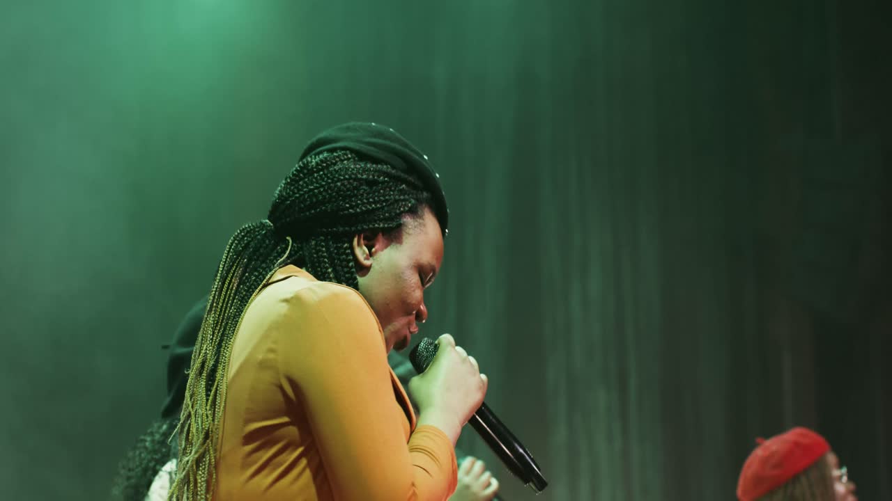 Woman Singing on Stage