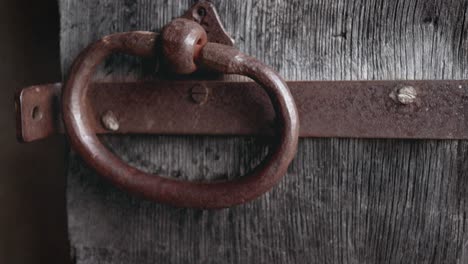 Church-old-wooden-door-with-a-copper-metal-knob