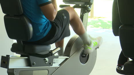 person exercising on a stationary bike