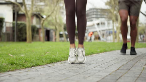 fitness, woman and man skipping rope on street