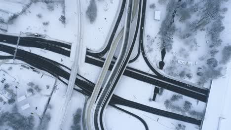 Aerial-view-of-a-freeway-intersection-Snow-covered-in-winter.