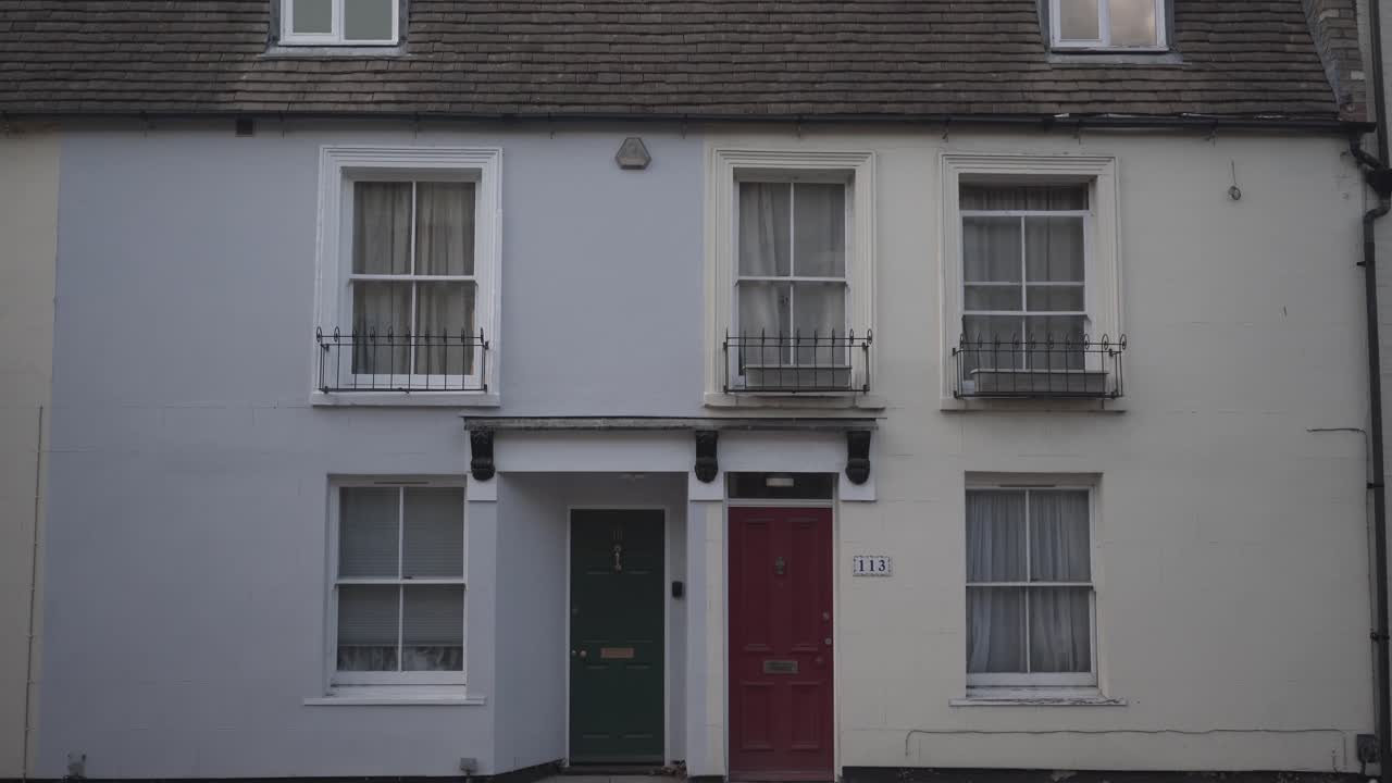 typical beautiful houses in Cambridge, England in two different light colours