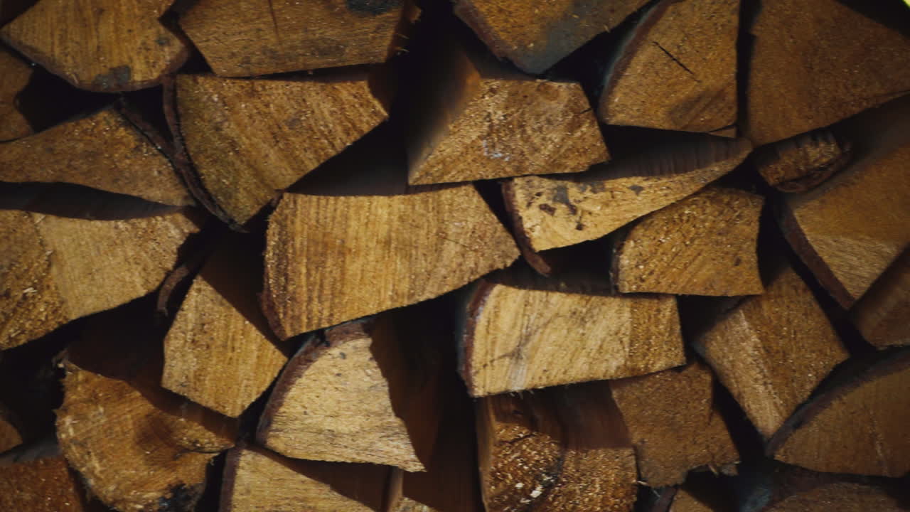 Stacks of firewood for heating house. Close up preparation of firewood