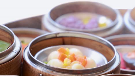 close-up of colorful dim sum in bamboo baskets, showcasing vibrant ingredients under natural lighting in a restaurant setting