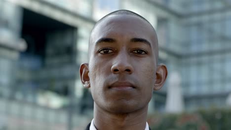 serious african american businessman looking at camera