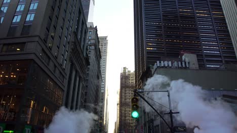 smoke on a busy nyc new york city manhattan street aerial drone shot