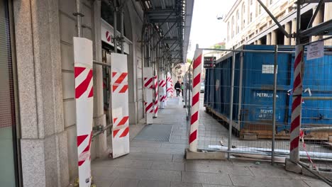 construction work and barriers on a busy street