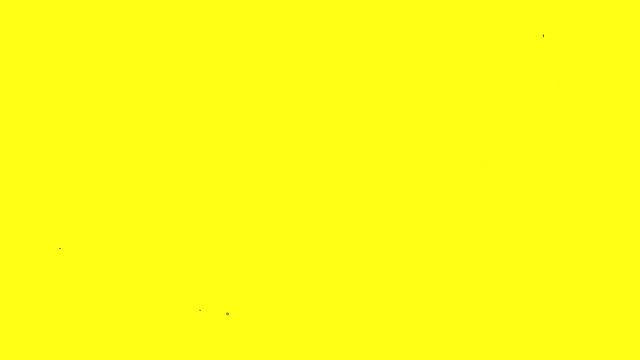 Goccioline di Inchiostro Marrone che Schizzano su Sfondo Giallo Vivace