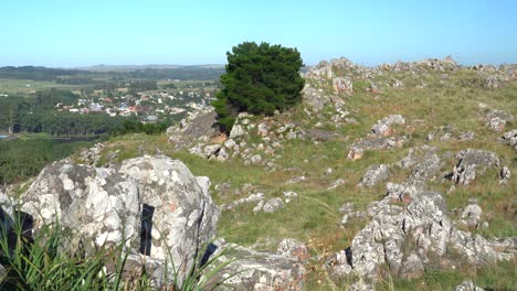 The-beautiful-sierra-in-Tandil,-Argentina,-with-some-buildings-in-the-distance