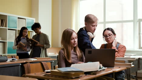 students working and studying together in a classroom