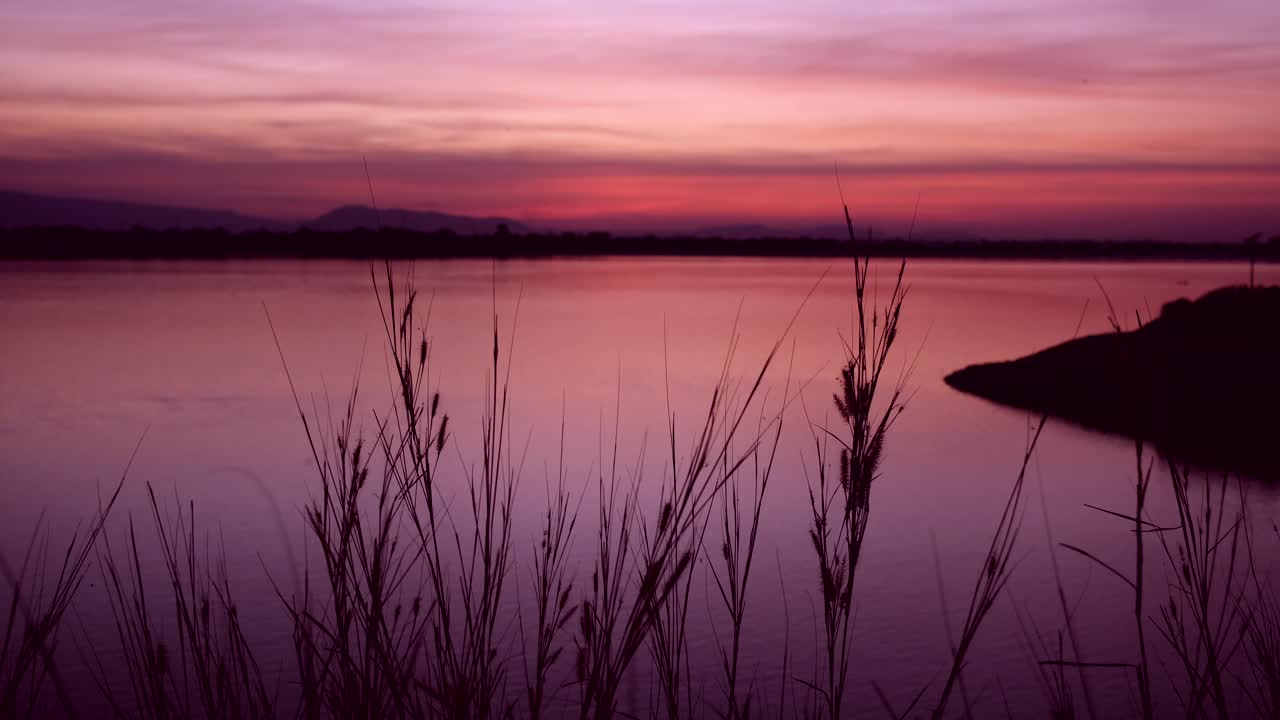A stunning 4K capture of a breathtaking natural landscape, where the setting sun evokes a sense of emotion and tranquility, inviting viewers to experience a serene and peaceful moment
