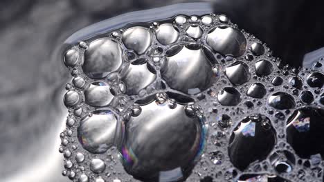 bubbles on the surface of water inside a metallic container