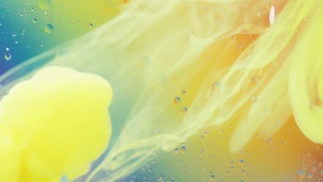 Animation-of-bubbles-and-yellow-liquid-moving-on-blue-and-orange-background-with-copy-space