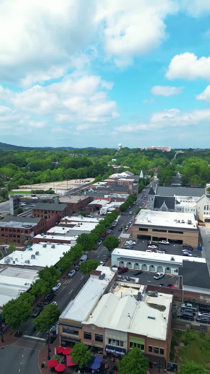 Flying Over Marietta Square With Marietta Station, And Church in Georgia, USA. - aerial vertical shot