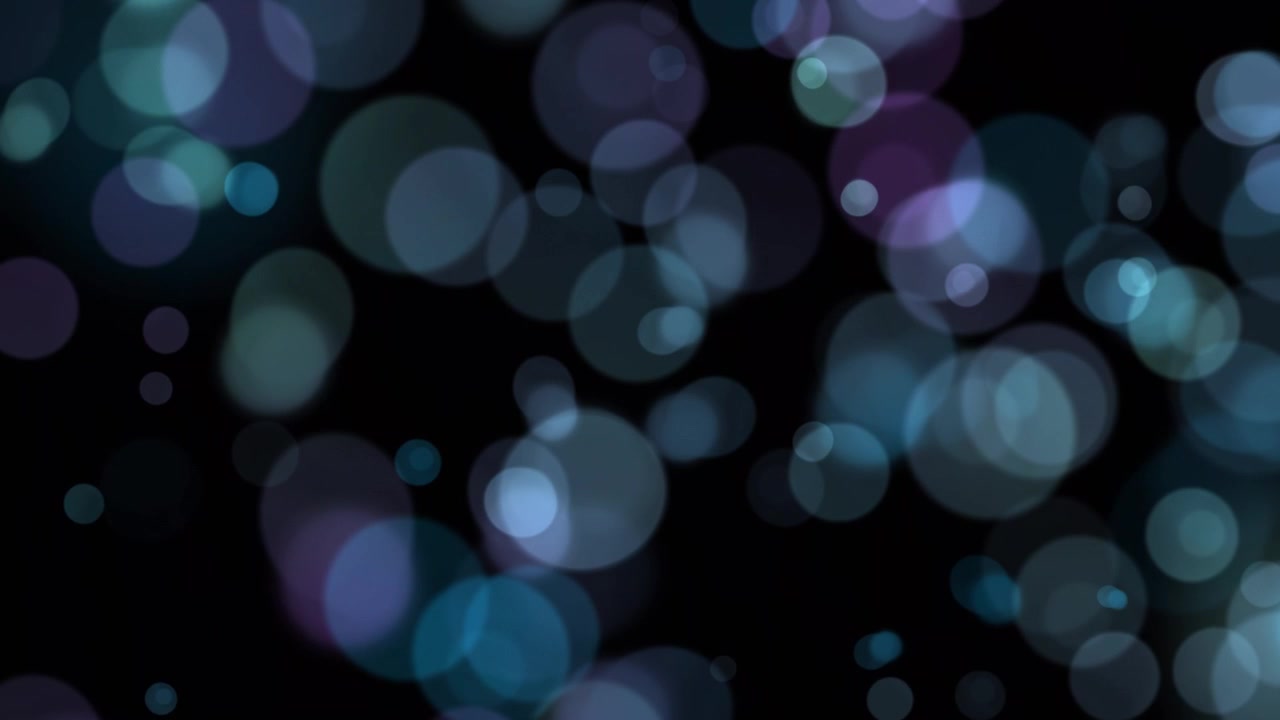 Luci bokeh astratte blu e viola che si muovono su sfondo scuro