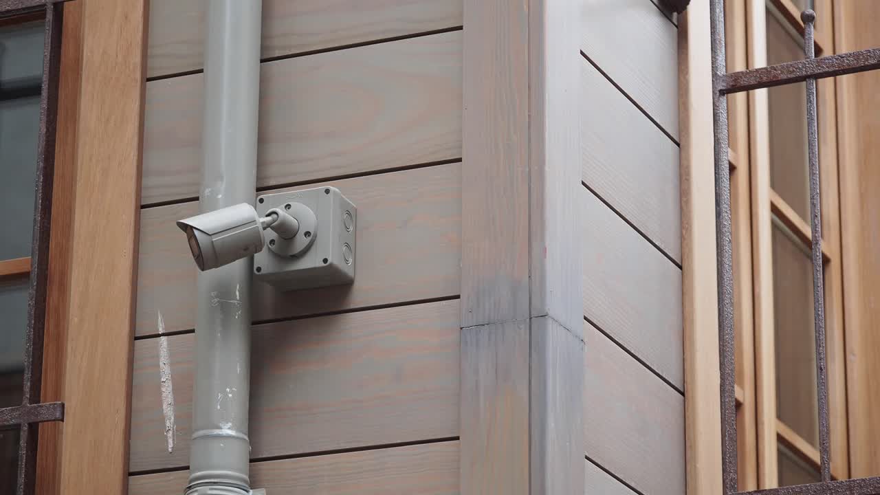 Outdoor security camera on building exterior