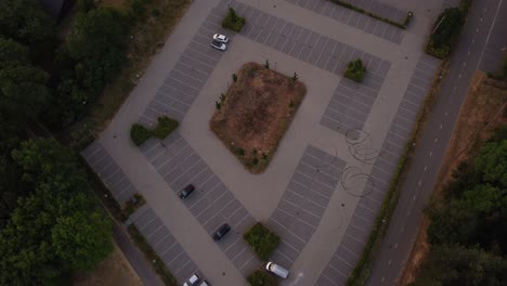 top shot of a parkingspot with lines and cars