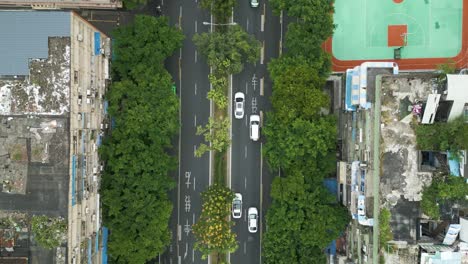 top-down-aerial-tracking-shot-of-cars-driving-along-streets-in-downtown-Chengdu