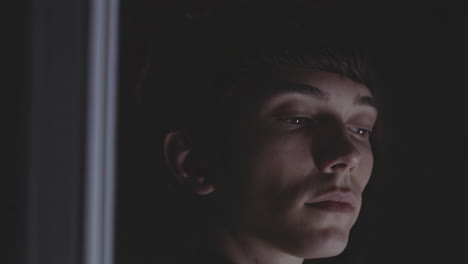 young man in shadow
