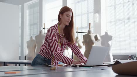 Caucasian-woman-working-in-fashion-office