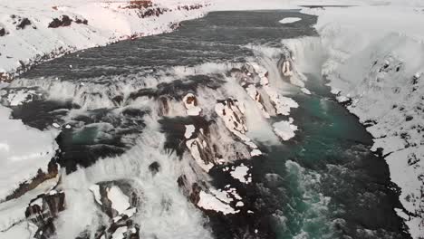 drone shot of gullfoss waterfall in iceland during winter