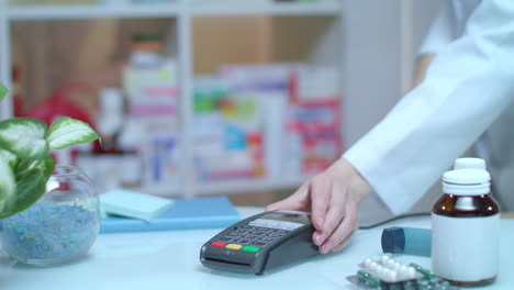 Credit-payment-at-drugstore.-Electronic-payment-at-pharmacy.-Pos-terminal