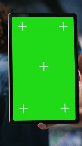 vertical video close up of data center admin using mockup tablet to update software