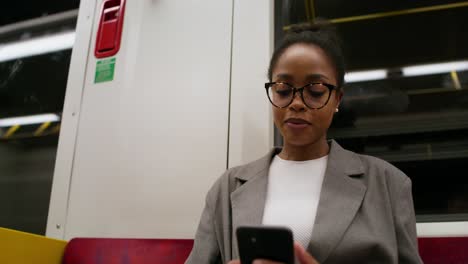 woman using phone on subway