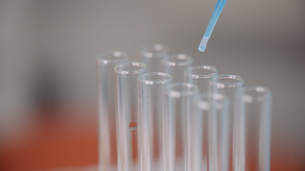 Working In Laboratory Scientist Using Pipette In Lab 