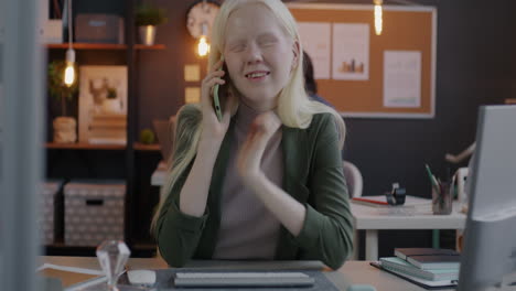 young woman on phone call in office